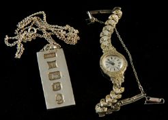 A silver hallmark ingot and chain 37g, and a cocktail marcasite watch