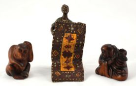 Bronze figure of Arab rug seller stamped Vienna t/w two carved wood Japanese netsukes