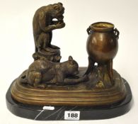Large bronze sculpture depicting a monkey, a cat and a cauldron
