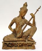 20th century metal model of an Indian Deity with instrument, 36cm high
