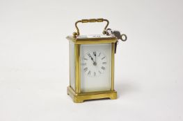 A French carriage clock in brass corniche case, 15cm, handle up with key