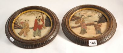 Two Chinese circular stoneware panels in carved wood frames, 18cm diameter
