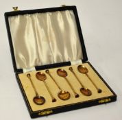 A set of six silver and enamelled and gilt English teaspoons in fitted case