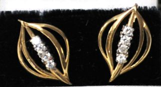 Pair of yellow metal and diamond effect earrings, unmarked