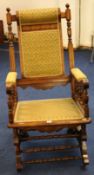 Edwardian rocking chair with upholstered back arms and seat