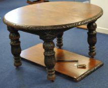 Victorian carved oak dining table with extra leaf, 128cm diameter