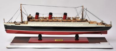 A scale model of `The RMS Queen Mary` with detailed decking and hull, 84cm long