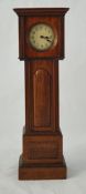 A miniature wood case longcase clock, 30cm high