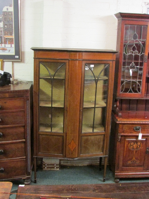 Edwardian inlaid mahogany bow fronted china cabinet with gothic glazed tracery, tapering square legs