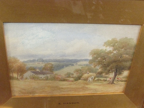 Late 19th century watercolour of hay cart in meadow with cottage beyond, signed lower left,