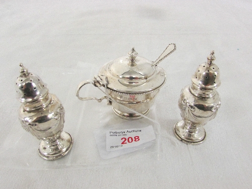 Two silver pepper pots of urn shape, the bodies with repousse swags, height 7cm, marks for