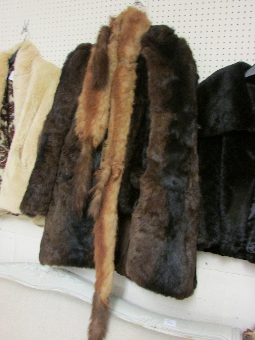 Fox fur ladies coat, one other fur coat and a bower