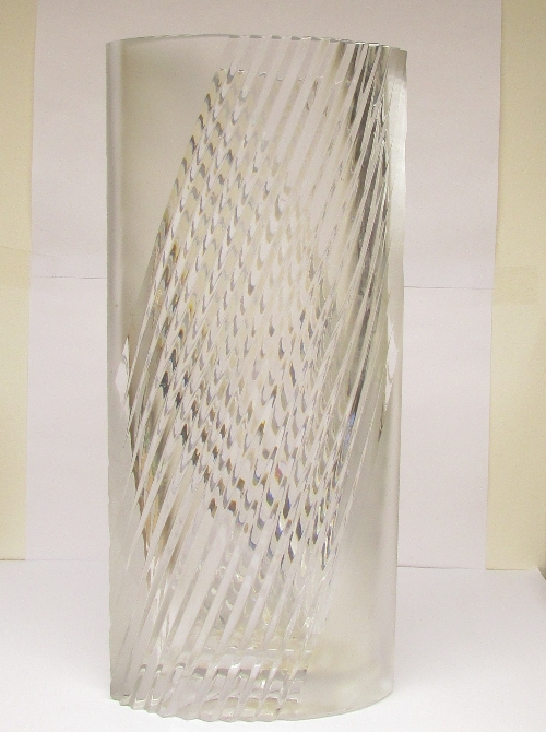 Studio glass vase of sharp oval section, the sides moulded with opposing oblique ridges between