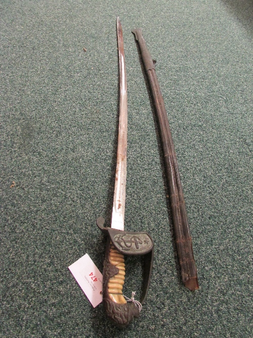 Replica sword with lion`s head hilt, the blade decoratively etched and stamped ARCHAK, in