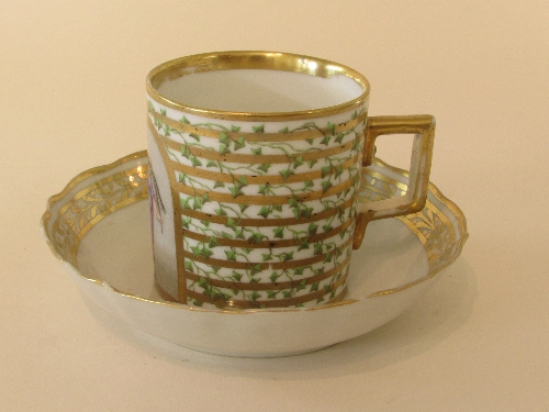 Porcelain cup and saucer, the cup of gently tapering cylindrical form with gilded rim and angular