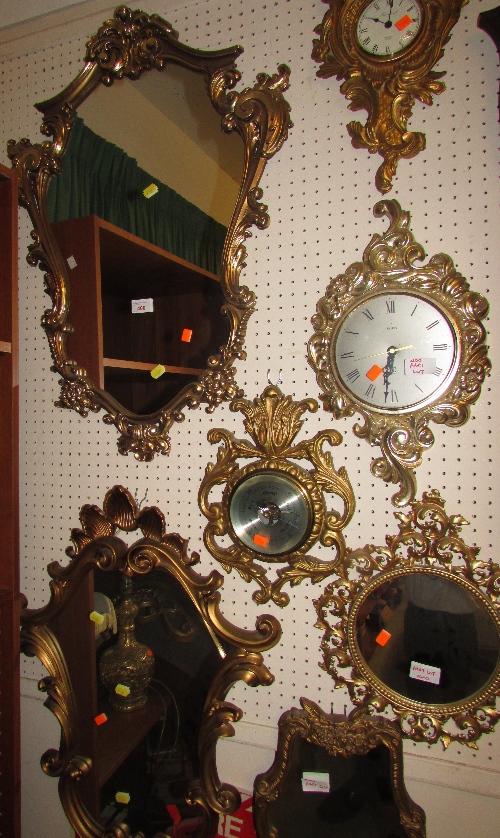 Two late 20th century reproduction cartouche shape mirrors in gilt finish (heights 74cm and 72cm),