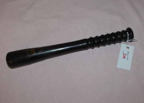 Hardwood truncheon with partially worn painted crown and initials VR, length 34cm