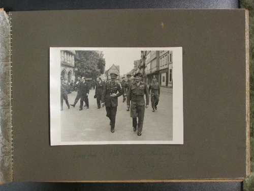 An interesting album of WWII black and white photographs, mounted recto on twenty four leaves,