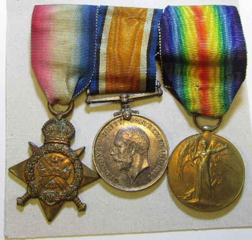 WW1 group of three medals awarded to Pte J Wells: 1914 star engraved to G-395 Pte J. Wells 4/Midd`