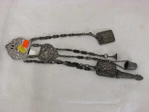 Victorian electroplated chatelaine with embossed mask head rectangular notepad, buffer, thimble,