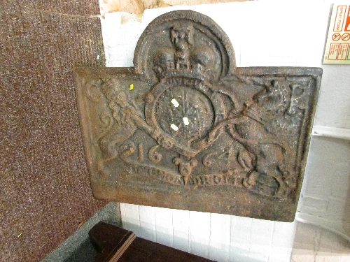 Iron fire back cast dated 1664 with the Royal Coat of Arms flanked by initials C R, (height 64cm,