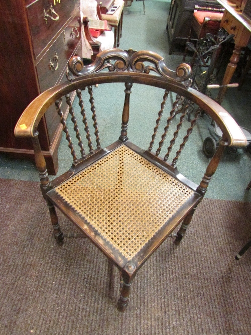 1930s stained beech wood corner chair with barley twist back supports, cane seat and cross