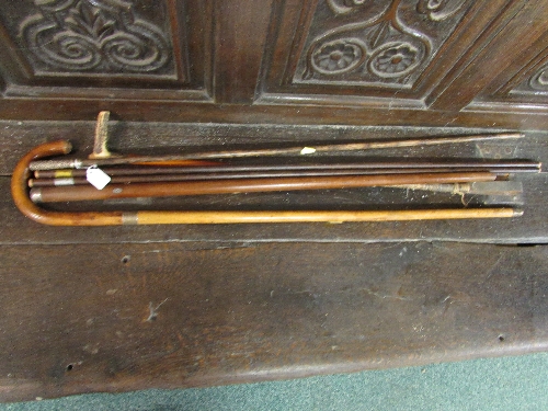 A selection of three hickory and other walking and swagger sticks with horn and silver handles and