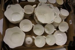 A collection of pottery items to include Aynsley Pembroke planters, vases and commemorative mugs