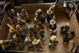 A collection of unmarked figurines conflicting village life (20)