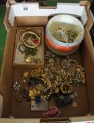 A collection of vintage costume jewelry consisting of beads, broaches, bangles etc,