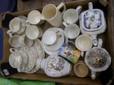 A collection of various Pottery to include a Gilded Tea Set, Wade Tea Pot, Commemorative Mugs etc