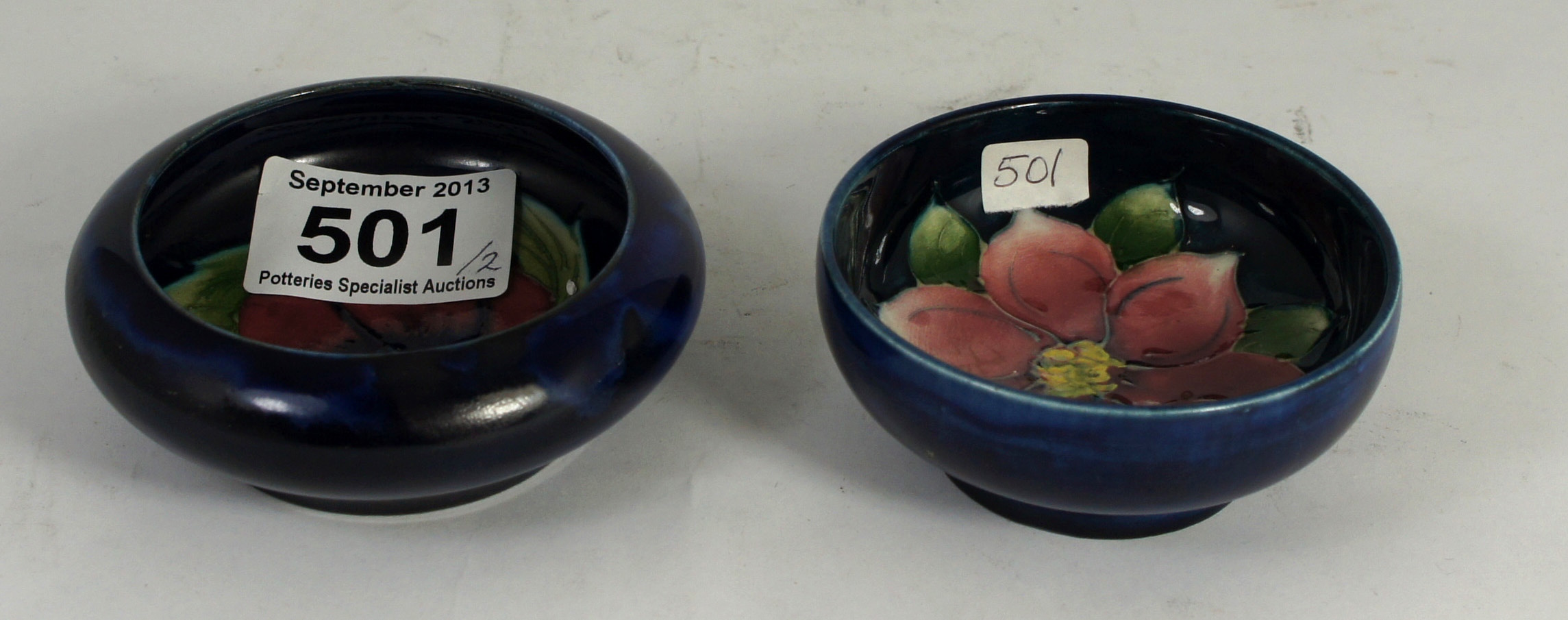 Moorcroft small dishes decorated in the Pansy and Clematis designs, largest diameter 9cm  (2)