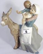 Lladro Figure of a Lady Carrying a Child with a Donkey