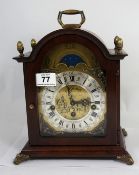A good quality reproduction mahogany bracket clock with moon rolling dial, made in Holland