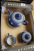 Early Wedgwood Dark Blue Jasper Tea Set comprising Tea Pot, Stand, Covered Sugar and Cream Jug