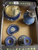 A collection of Wedgwood Dark Blue Jasper to include a Biscuit Barrel with Plated Lid, Candlesticks,