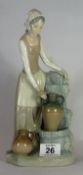 Nao Figure of a Lady Filling a Water Jug, height 29cm
