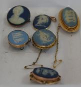 A collection of Wedgwood Dark and Light Blue Jasperware Brooches all with 9ct Gold Mounts Round