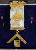A 15ct Gold and Silk Masonic Medal presented by the Officer and Members Lodge Burnett to Wur Bro A