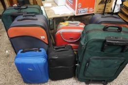Seven Suit Cases of Varying Shapes and Sizes (7)