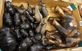 A collection of various Wooden Ebony and Metal Elephant Figures in various Poses (24)