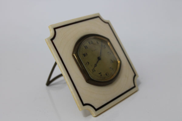 Edwardian desk clock with eight day movement, gilt cushion-shaped dial set in ivory plaque with