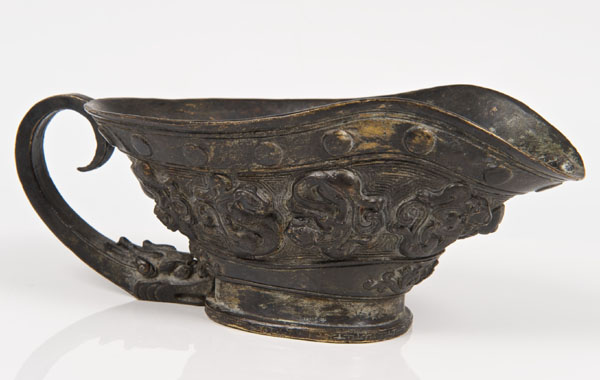 Antique Chinese bronze Libation cup with stylised dragon decoration within beaded and Greek key