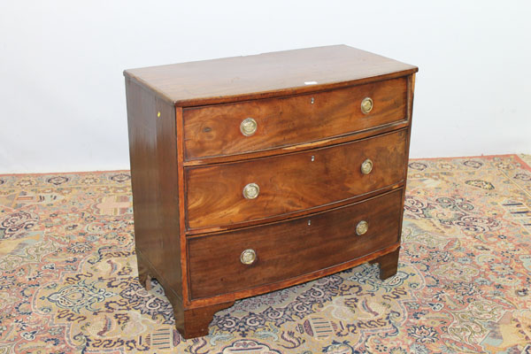 Nineteenth century mahogany bow front chest of three long graduated drawers on bracket feet, 90cm