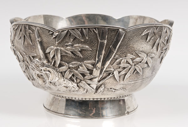 Late nineteenth century Japanese silver punch bowl of circular form, with embossed bamboo, prunus