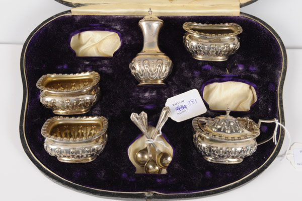 Early George V part condiment set comprising three salts of compressed campana form, with raised