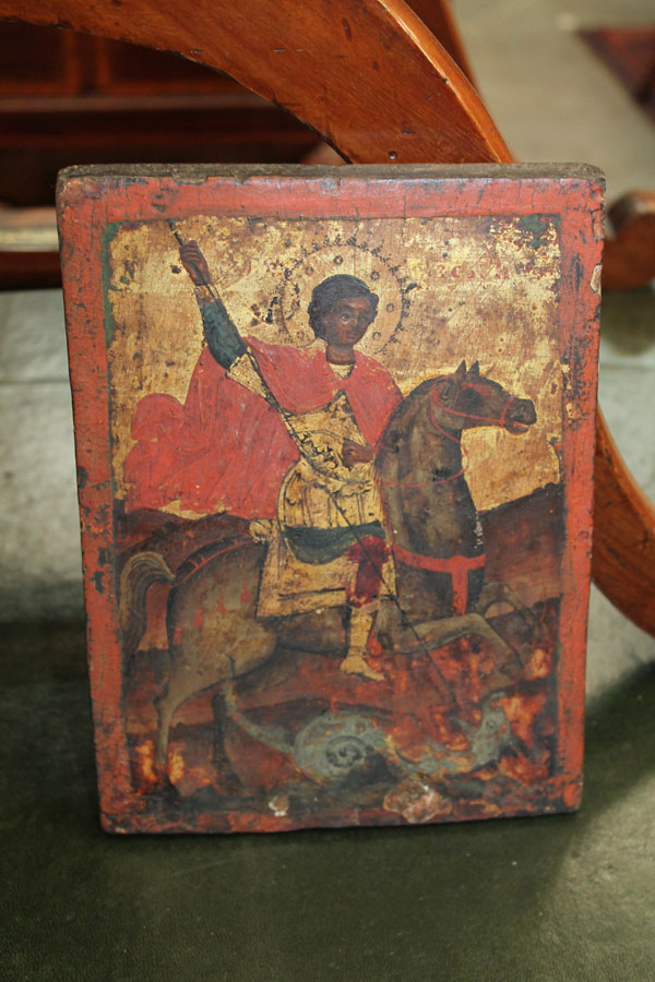 Antique, believed eighteenth century, Russian Icon on panel of St. George slaying the Dragon, with