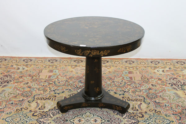 Chinese black lacquered circular table with chinoiserie decoration, on turned column and trefoil