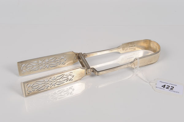 Pair of Victorian silver asparagus servers with pierced blades (London 1865), George Adams.  All
