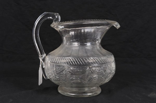 Good quality Georgian cut glass jug with slice, rope and star cut decoration, faceted loop handle,